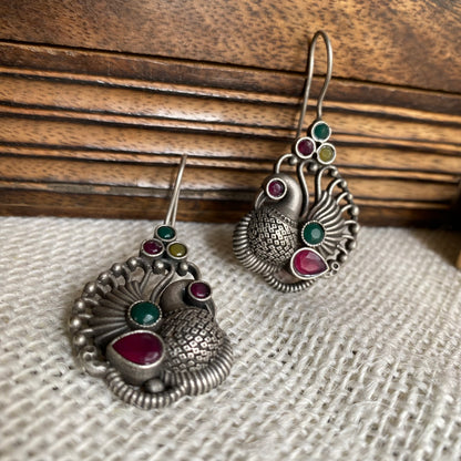 Multi peacock studs