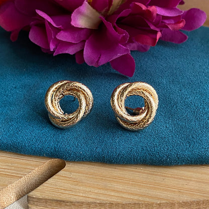 Knotted golden studs