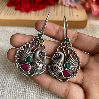 Multi peacock studs