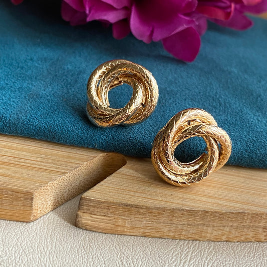 Knotted golden studs