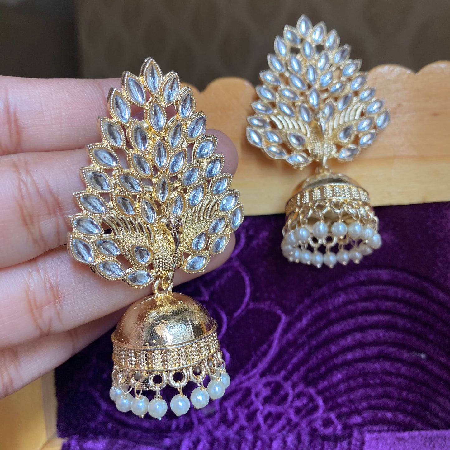 Gold peacock jhumkas